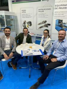 Merlin Diesel Systems representatives sit with trade show participants at Motortec Madrid 2022